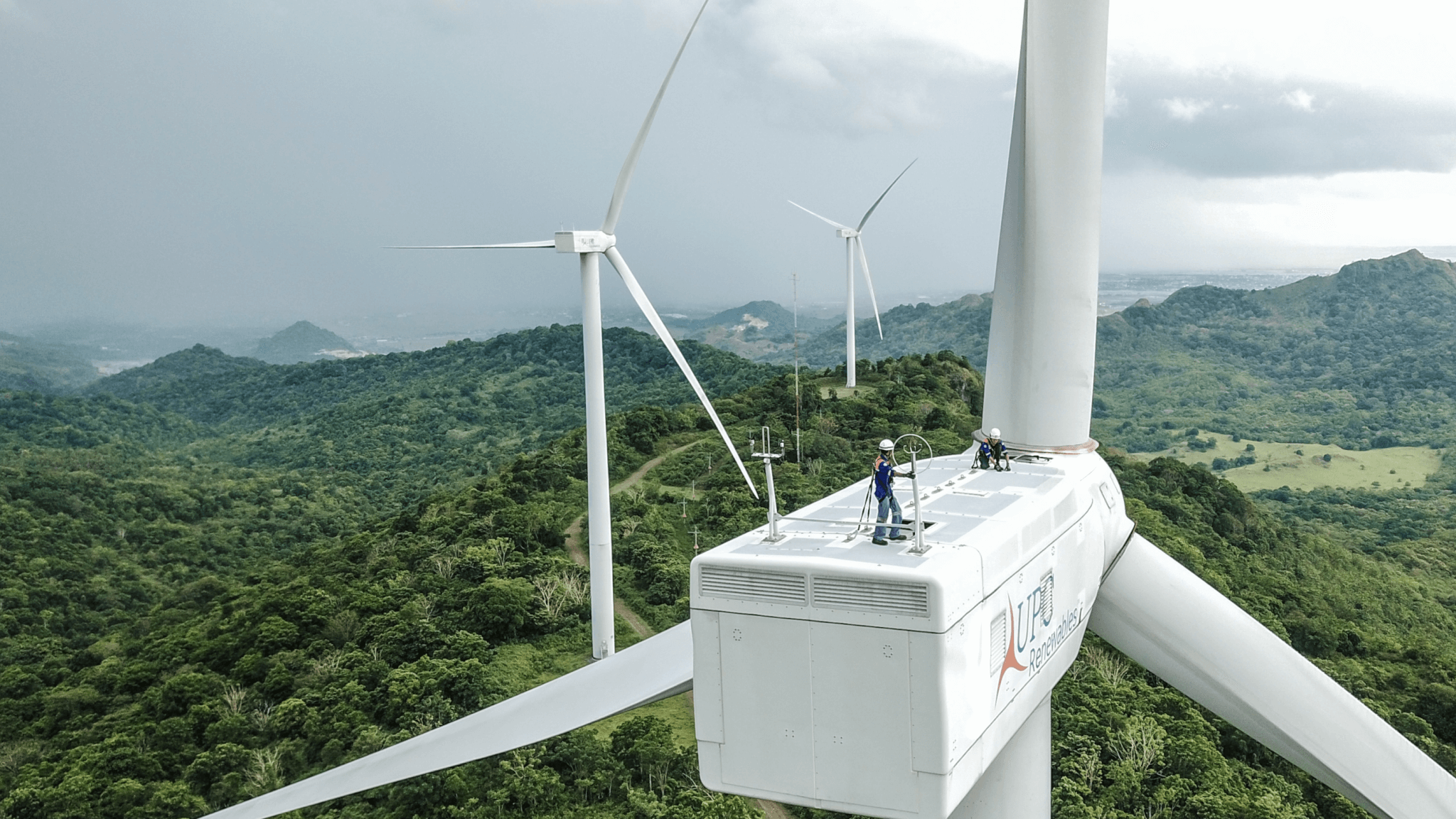 Two wind turbine technicians at work